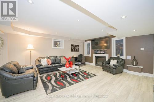 16 Casserley Crescent, New Tecumseth, ON - Indoor Photo Showing Living Room With Fireplace