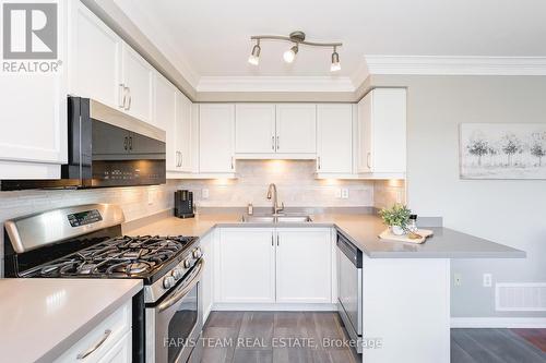 66 John W Taylor Avenue, New Tecumseth, ON - Indoor Photo Showing Kitchen With Double Sink With Upgraded Kitchen