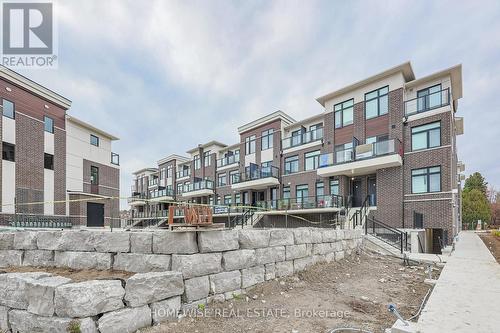 203 - 755 Omega Drive, Pickering, ON - Outdoor With Balcony With Facade