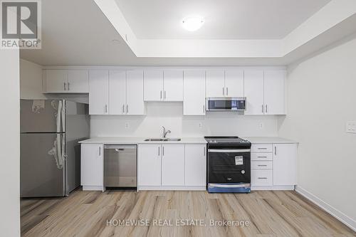 203 - 755 Omega Drive, Pickering, ON - Indoor Photo Showing Kitchen With Double Sink