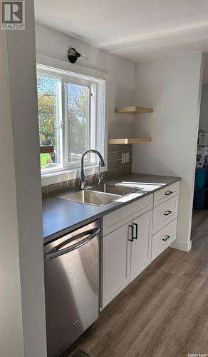 100 4Th Street, Dunblane, SK - Indoor Photo Showing Kitchen With Double Sink