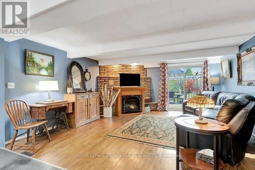 235 Winston Street E, North Perth, ON - Indoor Photo Showing Living Room With Fireplace