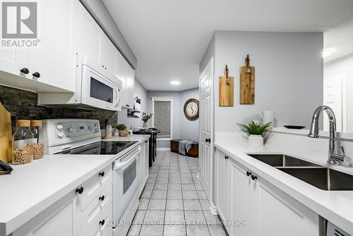 107 Shady Lane Crescent, Clarington (Bowmanville), ON - Indoor Photo Showing Kitchen With Double Sink