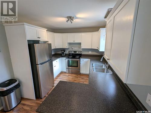 105 Haichert Street, Warman, SK - Indoor Photo Showing Kitchen With Double Sink