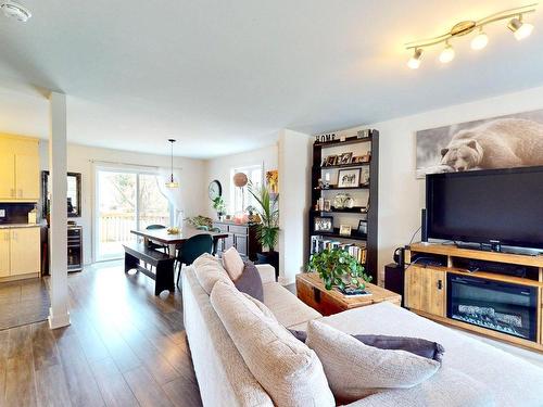 Living room - 1499  - 1501 Av. Rawlinson, Mascouche, QC - Indoor With Fireplace