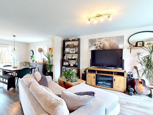 Living room - 1499  - 1501 Av. Rawlinson, Mascouche, QC - Indoor Photo Showing Living Room With Fireplace