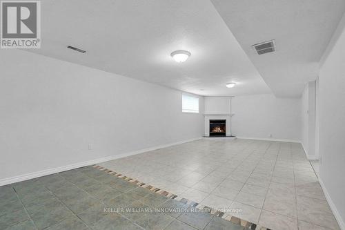 820 Tremaine Avenue S, North Perth, ON - Indoor Photo Showing Other Room With Fireplace