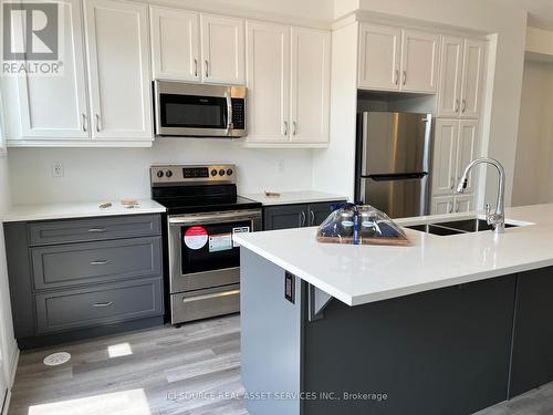 3022 John Mckay Boulevard, Oakville, ON - Indoor Photo Showing Kitchen With Stainless Steel Kitchen With Double Sink With Upgraded Kitchen