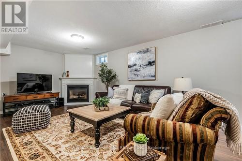 2 Aquasanta Crescent W, Hamilton, ON - Indoor Photo Showing Living Room With Fireplace