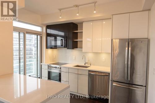 1208 - 33 Shore Breeze Drive, Toronto, ON - Indoor Photo Showing Kitchen With Upgraded Kitchen