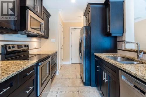 410 - 340 Sugarcreek Trail N, London, ON - Indoor Photo Showing Kitchen With Double Sink