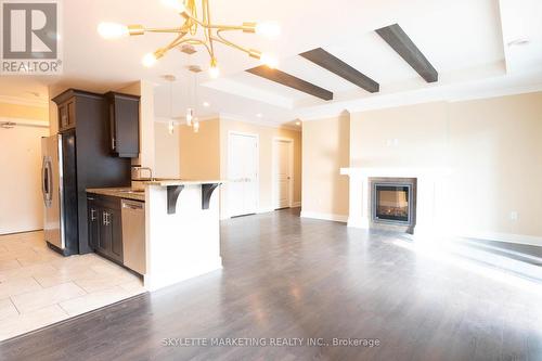 410 - 340 Sugarcreek Trail N, London, ON - Indoor Photo Showing Kitchen With Fireplace