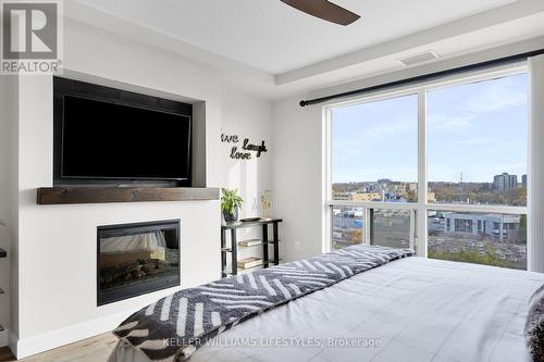 Electric Fireplace - 908 - 330 Ridout Street N, London, ON - Indoor Photo Showing Bedroom With Fireplace