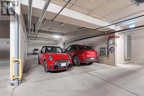 Side by Side Parking with Private EV charger - 908 - 330 Ridout Street N, London, ON - Indoor Photo Showing Garage