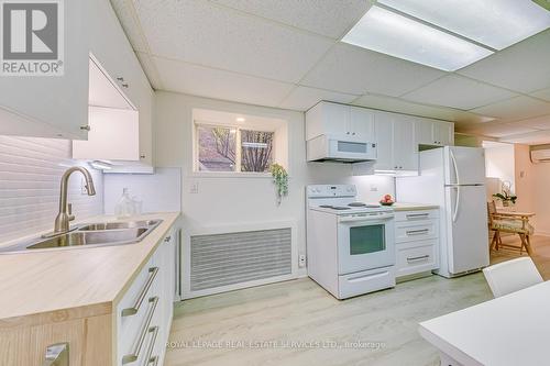 4 - 63 High Park Boulevard, Toronto, ON - Indoor Photo Showing Kitchen With Double Sink