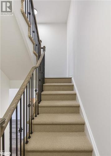 Stairway with carpet flooring - 25 Wyn Wood Lane, Orillia, ON - Indoor Photo Showing Other Room