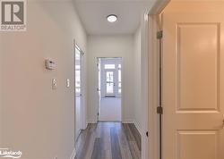 Corridor with dark wood-type flooring - 