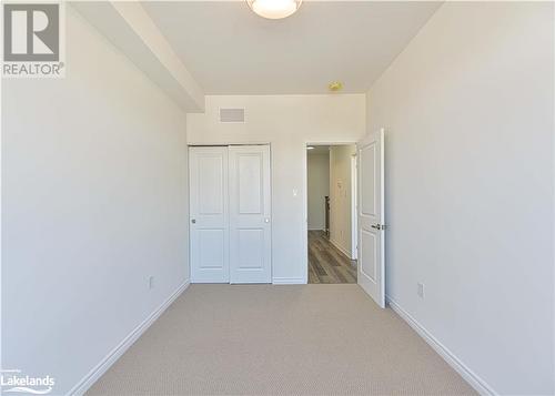 Unfurnished bedroom featuring carpet floors and a closet - 25 Wyn Wood Lane, Orillia, ON - Indoor Photo Showing Other Room