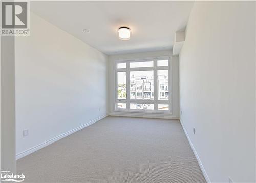 View of carpeted empty room - 25 Wyn Wood Lane, Orillia, ON - Indoor Photo Showing Other Room