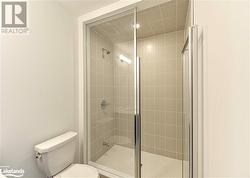 Bathroom featuring walk in shower and toilet - 