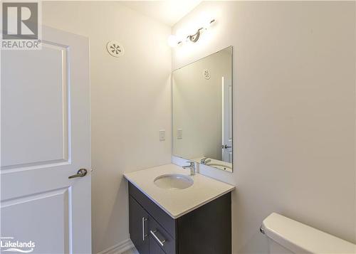 Bathroom with vanity and toilet - 25 Wyn Wood Lane, Orillia, ON - Indoor Photo Showing Bathroom