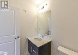 Bathroom with vanity and toilet - 