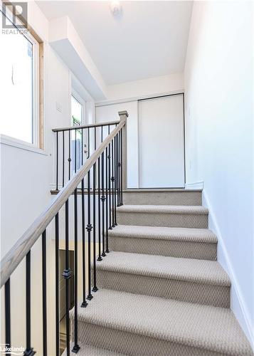 Stairway with carpet - 25 Wyn Wood Lane, Orillia, ON - Indoor Photo Showing Other Room