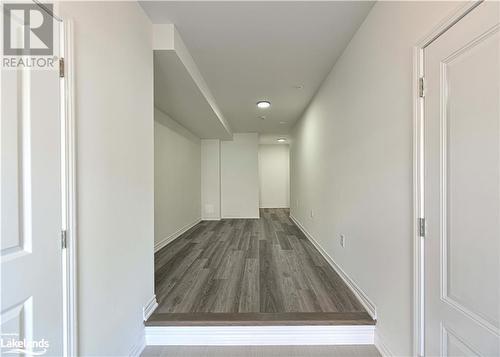 Hallway with dark hardwood / wood-style flooring - 25 Wyn Wood Lane, Orillia, ON - Indoor Photo Showing Other Room