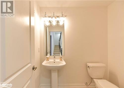 Bathroom with toilet and sink - 25 Wyn Wood Lane, Orillia, ON - Indoor Photo Showing Bathroom