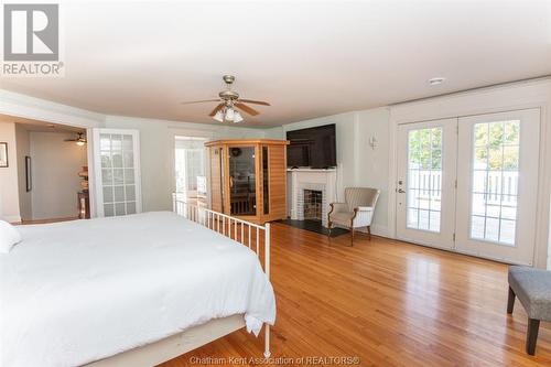 13590 Longwoods Road, Thamesville, ON - Indoor Photo Showing Bedroom With Fireplace