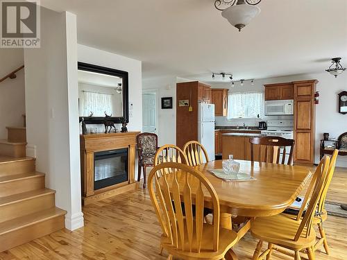 24-36 Tamarack Drive, Cormack, NL - Indoor Photo Showing Dining Room With Fireplace