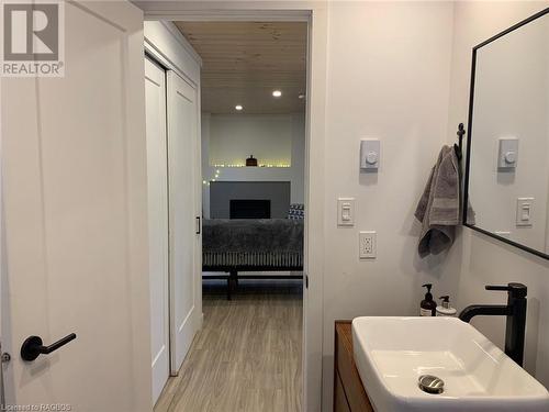 Bathroom featuring wood-style flooring and sink - 2 John Street, Lions Head, ON - Indoor Photo Showing Bathroom