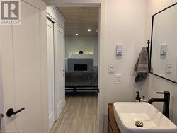 Bathroom featuring wood-style flooring and sink - 