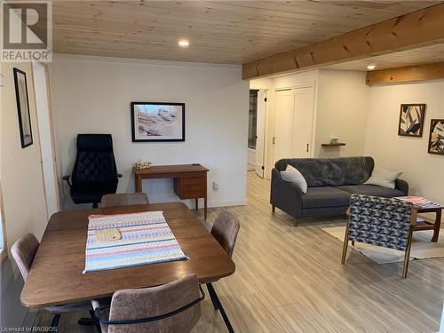 Dining room with wooden ceiling and  wood-style flooring - 2 John Street, Lions Head, ON - Indoor