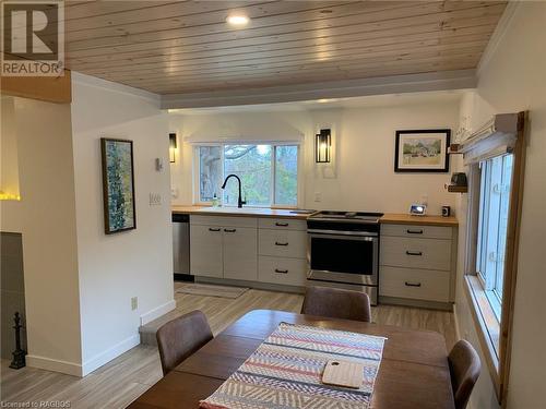 Kitchen stainless steel appliances, sink, and wood ceiling - 2 John Street, Lions Head, ON - Indoor Photo Showing Dining Room