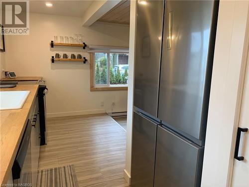 Kitchen with stainless steel appliances, wooden counters, sink - 2 John Street, Lions Head, ON - Indoor