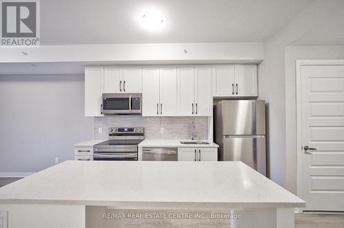 302 - 480 Gordon Krantz Avenue, Milton, ON - Indoor Photo Showing Kitchen With Upgraded Kitchen