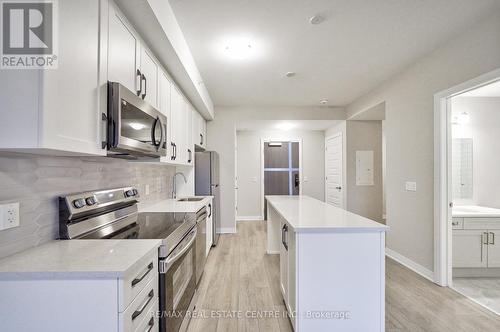 302 - 480 Gordon Krantz Avenue, Milton, ON - Indoor Photo Showing Kitchen With Upgraded Kitchen