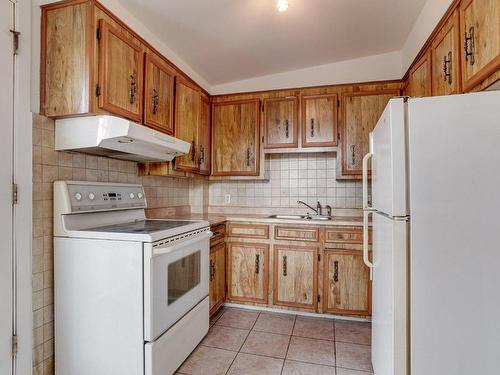 Cuisine - 8 Place Des Hirondelles, Laval (Duvernay), QC - Indoor Photo Showing Kitchen With Double Sink