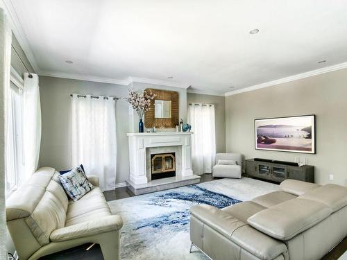 Salle familiale - 9034 Crois. Richmond, Brossard, QC - Indoor Photo Showing Living Room With Fireplace