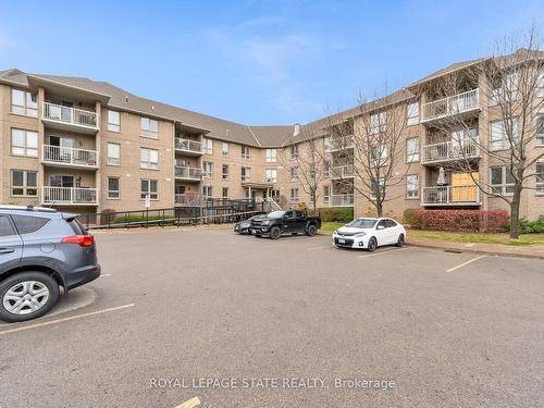 102-56 Kerman Ave, Grimsby, ON - Outdoor With Balcony With Facade