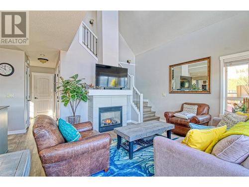 6895 Santiago Loop Unit# 101, Kelowna, BC - Indoor Photo Showing Living Room With Fireplace