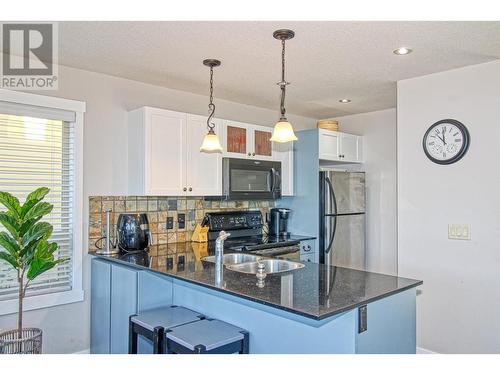 6895 Santiago Loop Unit# 101, Kelowna, BC - Indoor Photo Showing Kitchen With Double Sink