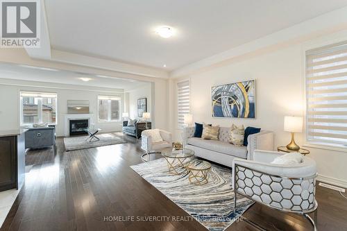 24 Dumaine Street, Whitby, ON - Indoor Photo Showing Living Room With Fireplace