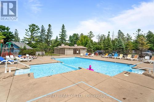 201 - 764 River Road E, Wasaga Beach, ON - Outdoor With In Ground Pool With Backyard