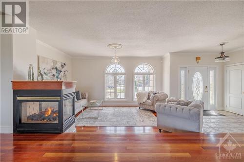 1135 Caprice Court, Ottawa, ON - Indoor Photo Showing Living Room With Fireplace