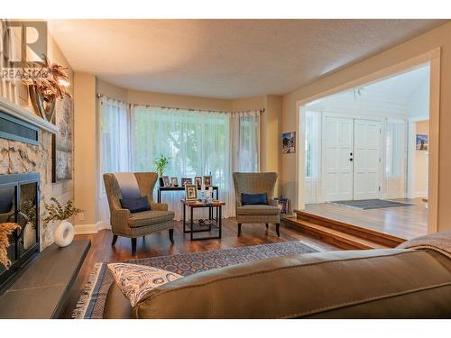 506 201St Avenue, Castlegar, BC - Indoor Photo Showing Living Room With Fireplace