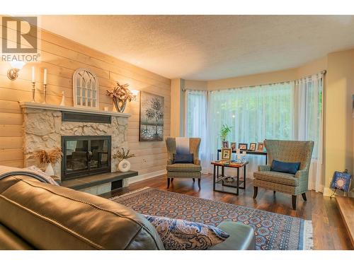 506 201St Avenue, Castlegar, BC - Indoor Photo Showing Living Room With Fireplace