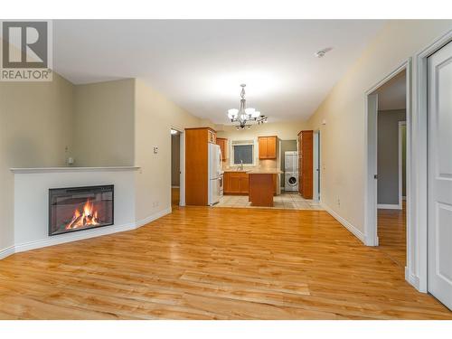 4433 Gordon Drive Unit# 117, Kelowna, BC - Indoor Photo Showing Living Room With Fireplace