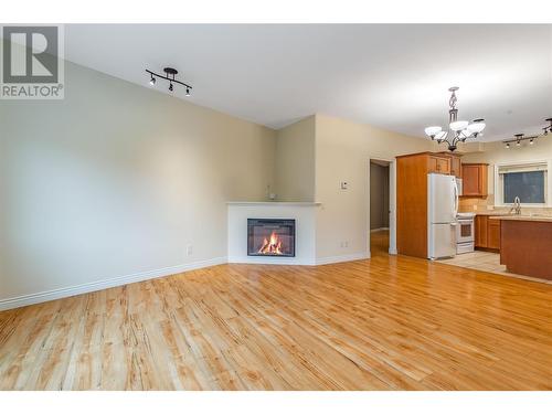 4433 Gordon Drive Unit# 117, Kelowna, BC - Indoor With Fireplace